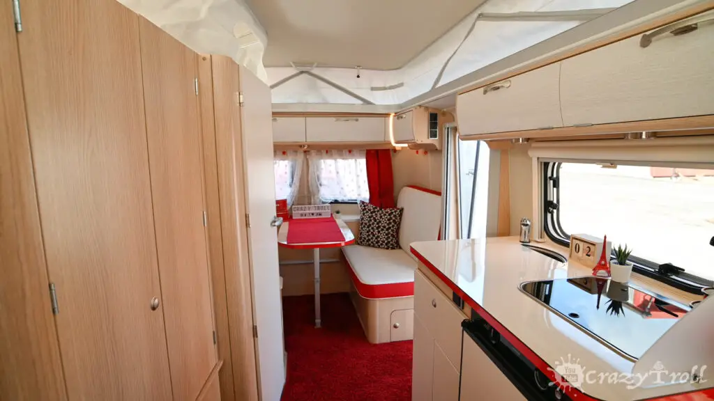 Interior of the Eriba Troll 530 Rockabilly caravan with unfolded pop top roof.