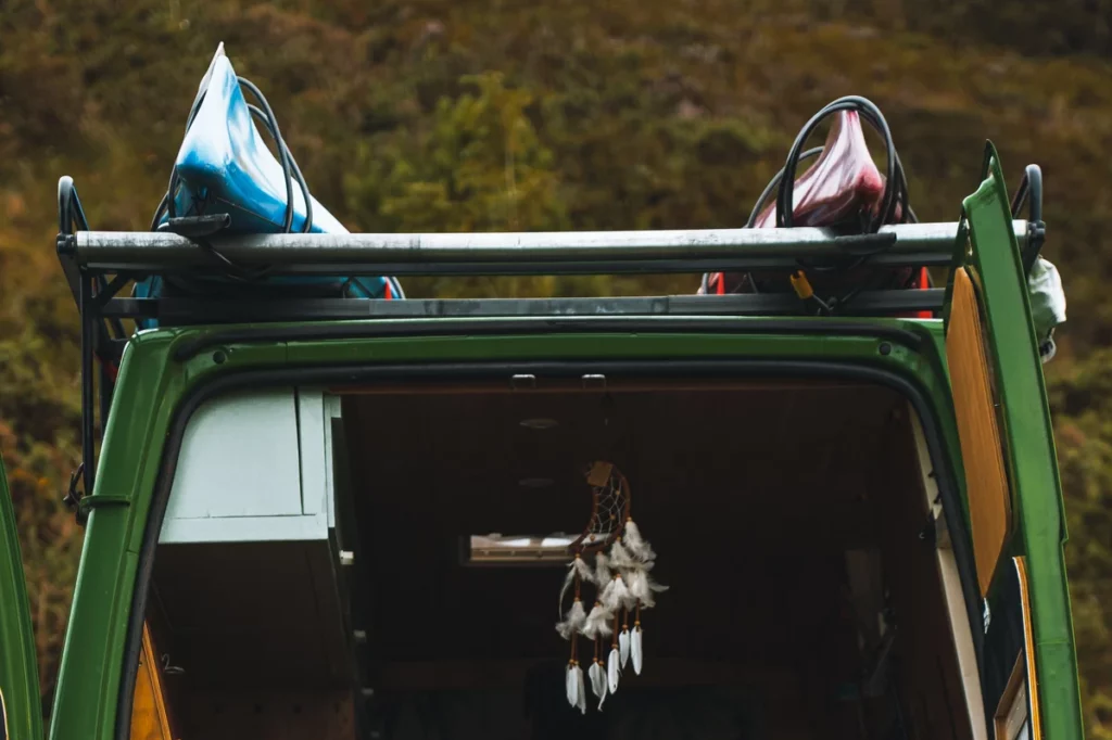 Pop-Up Camper with 2 kayaks secured on the roof Rack for kayaks